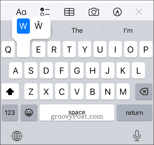 long press letter on iPhone keyboard